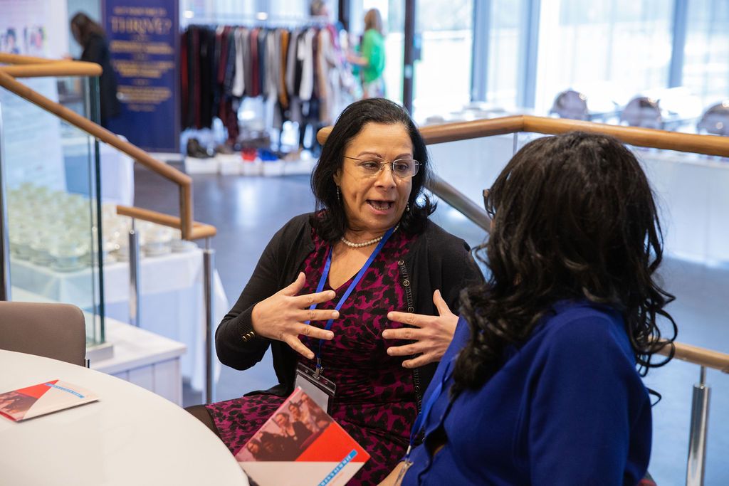 Two women deep in conversation at a Horizon Collective event