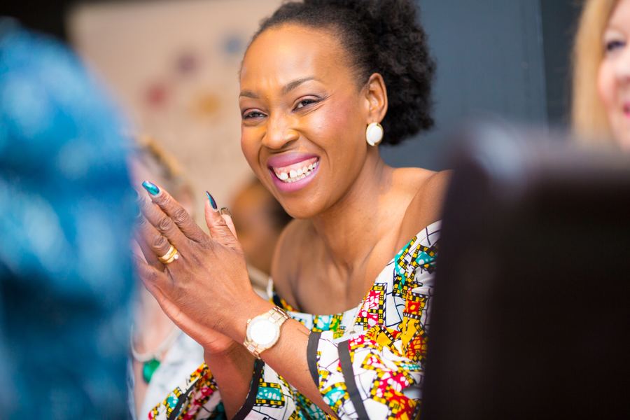 A woman laughing and applauding
